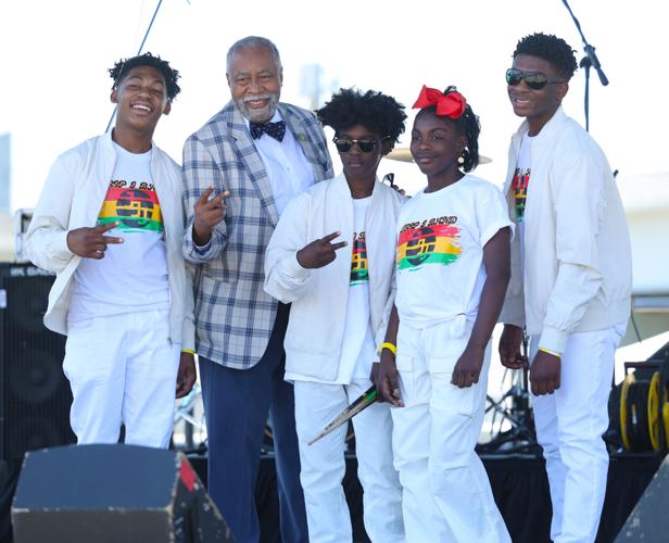 Gerald Neal takes a photo with a youth band at Louisville Juneteenth Festival.JPG