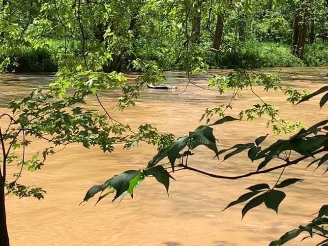 Man asleep with rum in raft