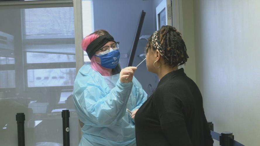 Visitor at the Jefferson County Clerk's Office gets tested for COVID-19