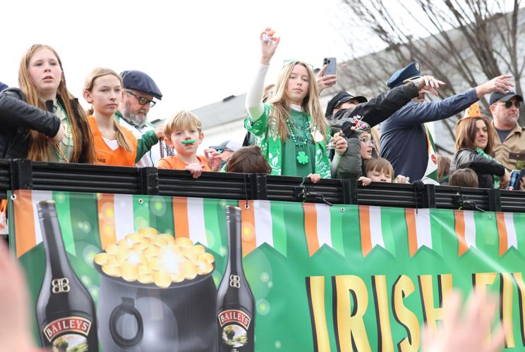 Girls wave to crowd at parade
