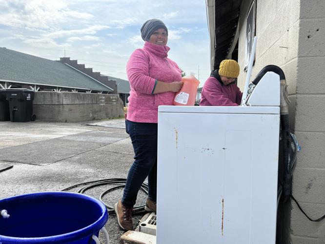 Workers wash supplies on backside ahead of 2023 Kentucky Derby