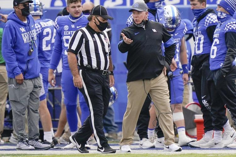 Kentucky head coach Mark Stoops speaks with an official