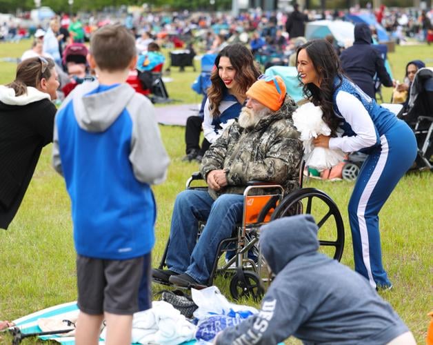 Colts cheerleaders pose for photo with man.JPG