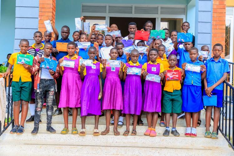Students hold up pencil bag.jpg