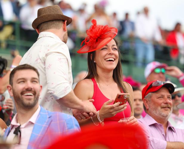 Woman smiles as race end at Churchill Downs.JPG