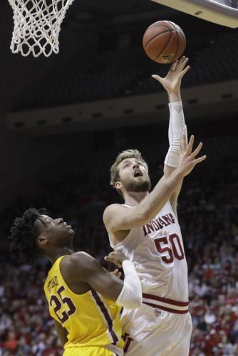 Indiana's Joey Brunk (50) shoots over Minnesota's Daniel Oturu