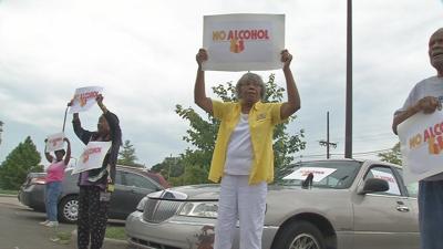 Dozens protest outside Louisville Family Dollar stores over alcohol sales