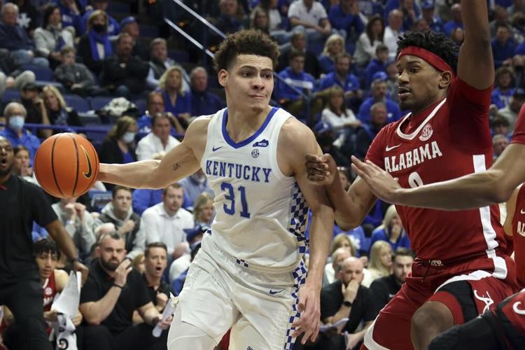 Kentucky's Kellan Grady drives as Alabama's Noah Gurley defends during the first half.jpeg