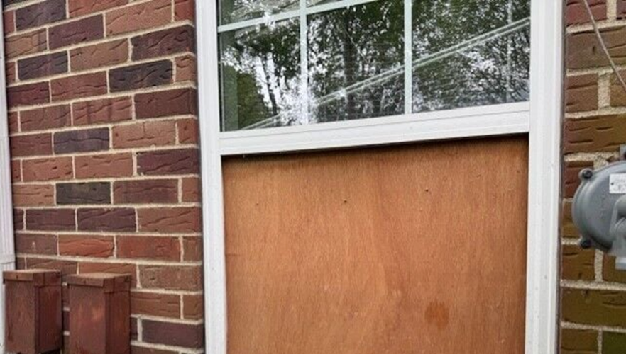 Boarded up window at apartment complex on Arterburn Avenue in Crescent Hill