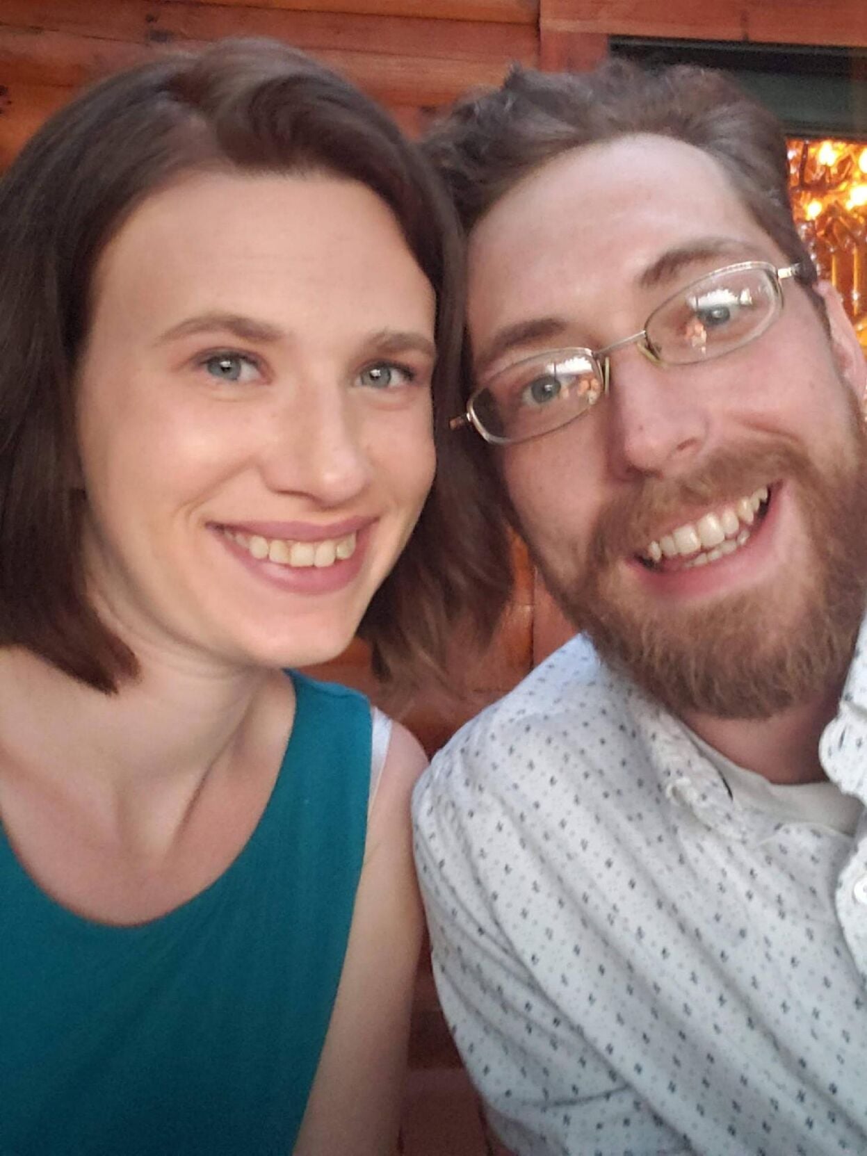 Nathan smiles with partner Hannah