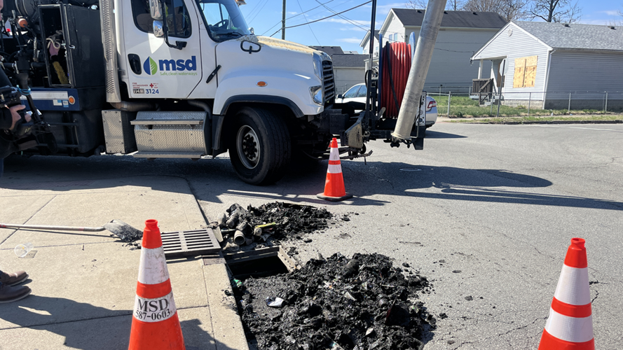 LMPD detectives look at street drains
