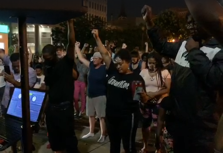 Protesters hold a moment of silence for Tyler Gerth in Jefferson Square Park