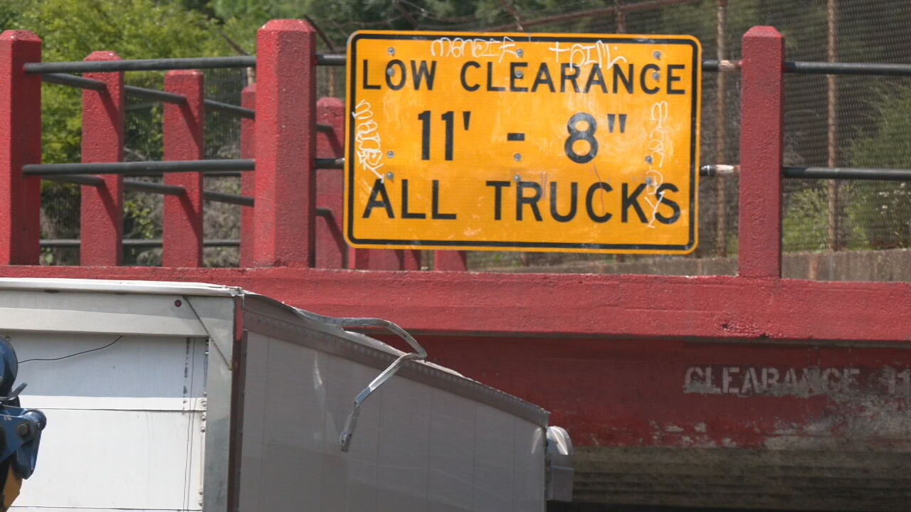 Truck gets stuck under low-clearance Louisville bridge as crashes