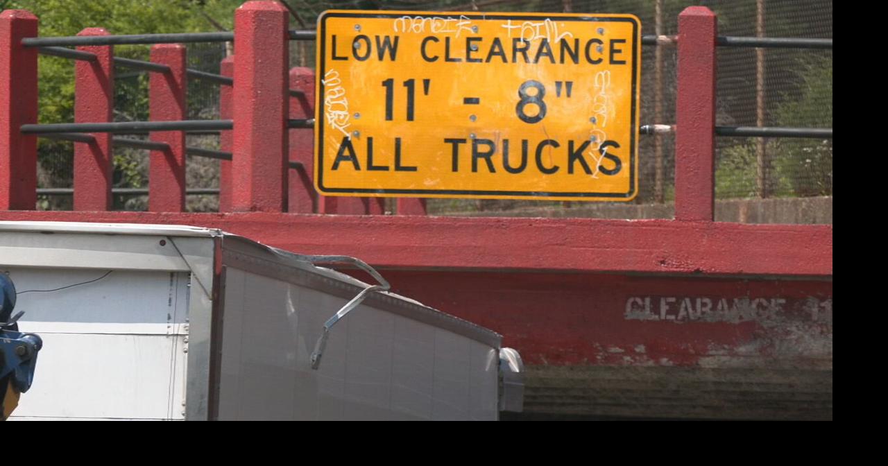 Truck gets stuck under low-clearance Louisville bridge as crashes continue