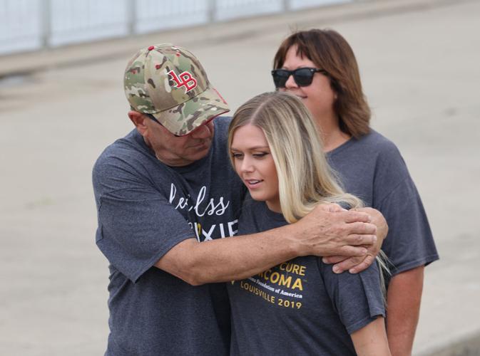 Larry Browning embraces Alexis Carrico