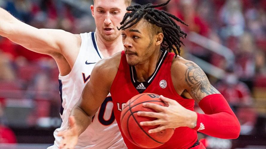 Louisville's Dre Davis drives to the basket