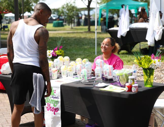 Vendor smiles at Juneteenth Festival.JPG