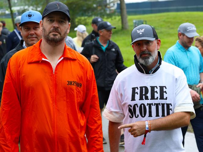 Two men with Free Scottie shirt.JPG