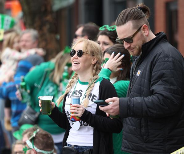 Woman in sunglasses waits for parade