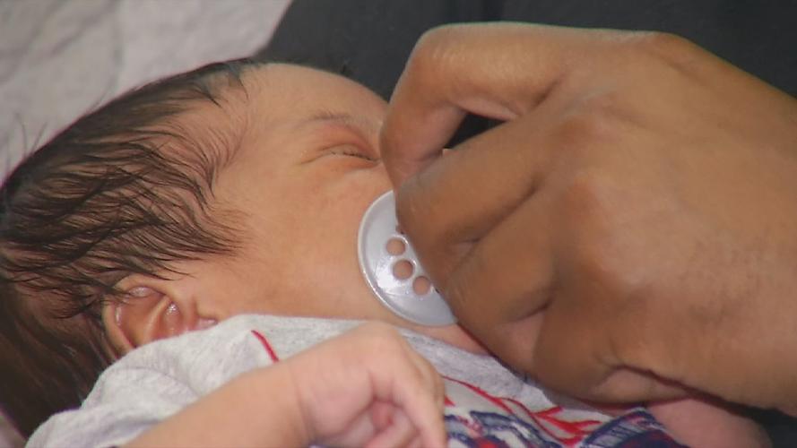 Family camps outside of Norton Hospital during pandemic to welcome baby