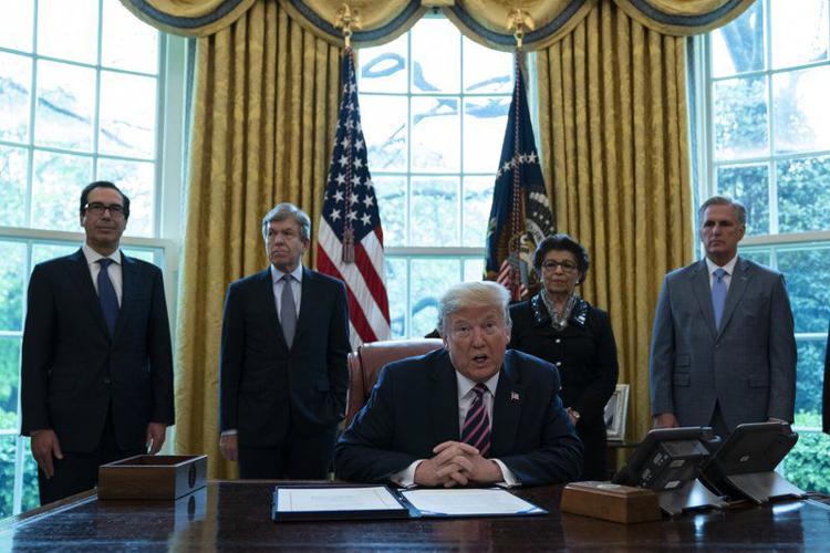 TRUMP SIGNS RELIEF BILL IN OVAL OFFICE - AP - 4-24-2020.jpeg