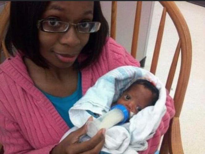 Baby Kaden bottle-fed by his mother