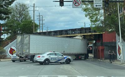 Semi-truck stuck under the 3rd Street overpass in Louisville on Sunday, April 23, 2023