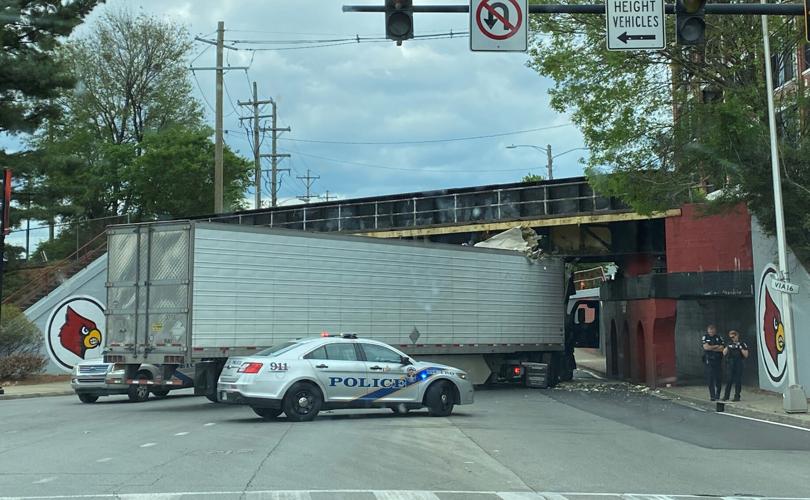 Semi-truck stuck under the 3rd Street overpass in Louisville on Sunday, April 23, 2023