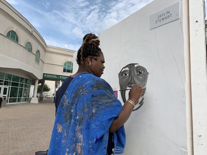 DOWNS AFTER DARK artist paints mural.jpeg