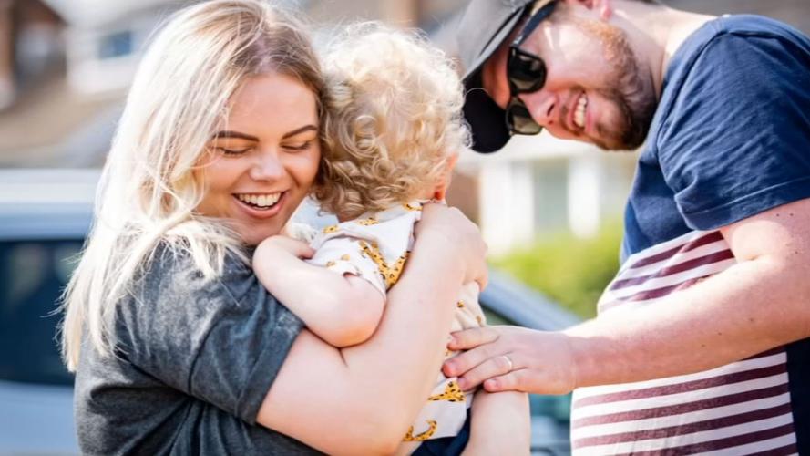 Parents hug son, England, COVID-19