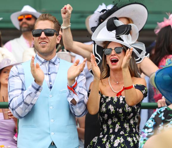 Two people clap during race at Section 124.JPG