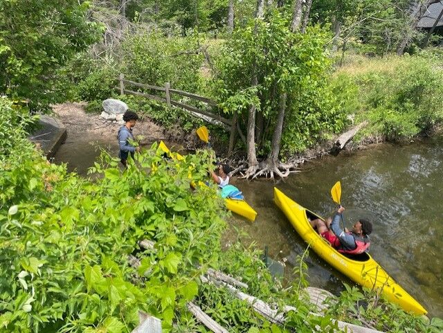 Basketball players kayak on KCARE trip
