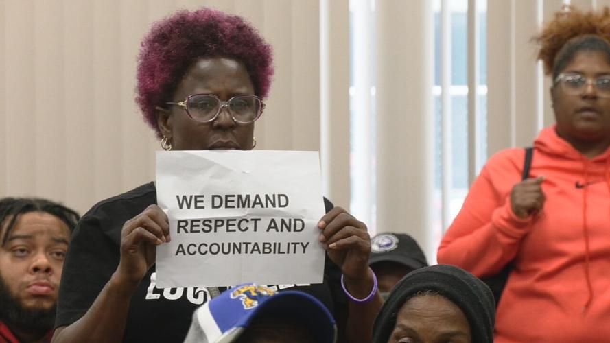 Dosker Manor resident with sign