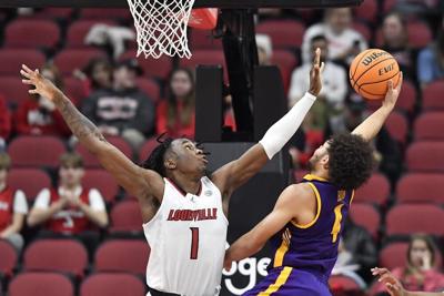 Mike James attempts to block a shot.jpg