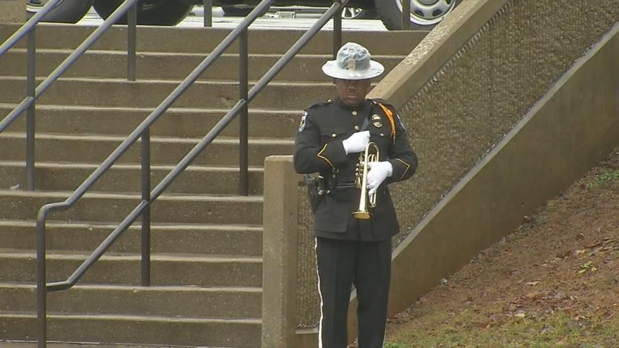 Bugler at funeral for Det. Deidre Mengedoht