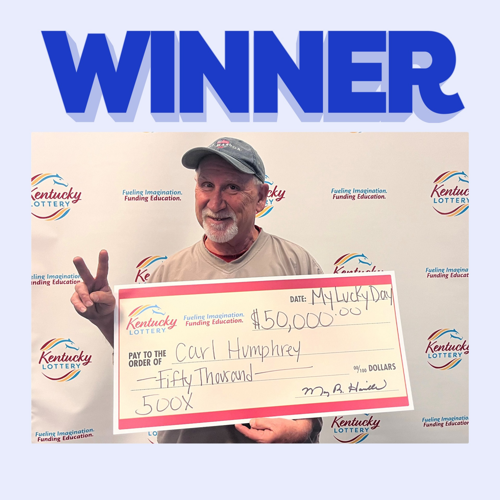 Carl Humphrey with check for winning scratch-off ticket