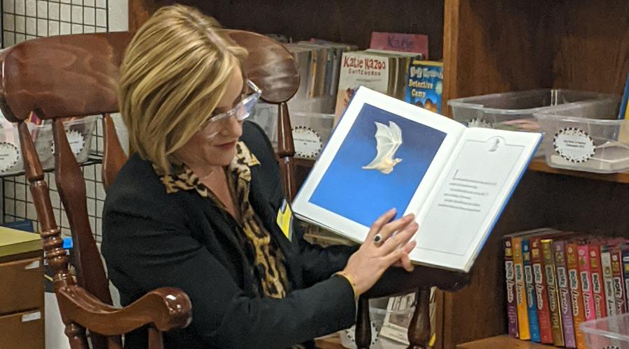 Elizabeth Woolsey reads to third graders at Bowen Elementary School
