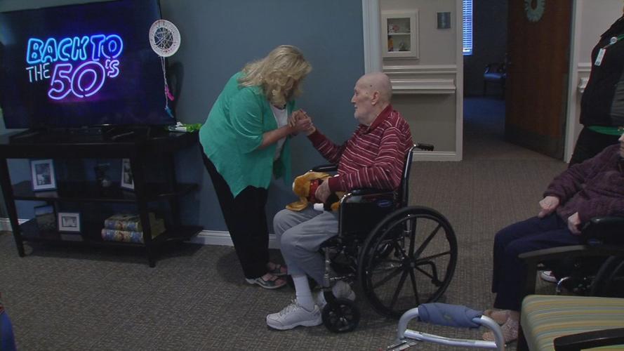 Senior with stuffed puppy brought by Pearl's Memory Babies