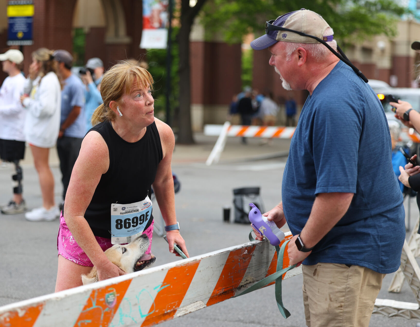 Woman meets dog at marathon race.JPG