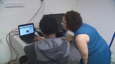 Teacher Helping Student