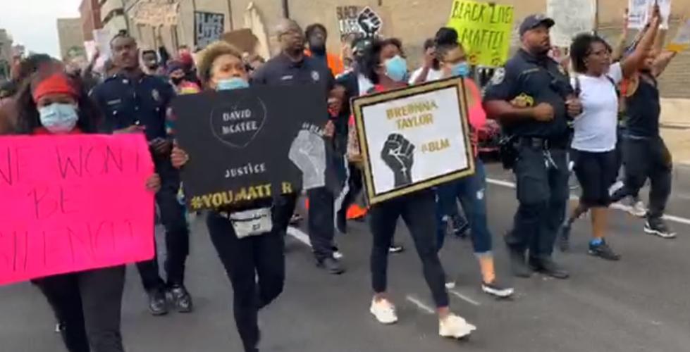 Protesters and police link arms 6-1-20
