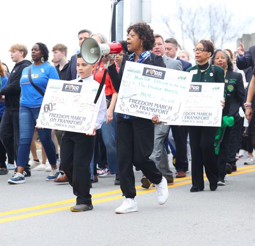 Signs move along road at March on Frankfort.JPG