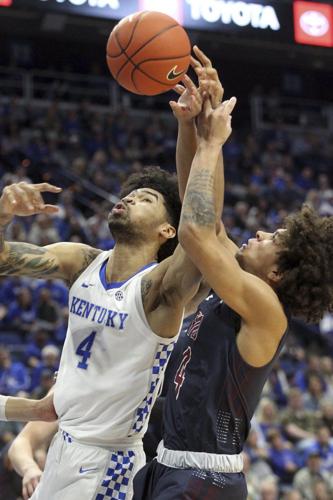 Kentucky's Nick Richards, left, and Fairleigh Dickinson's Brandon Powell