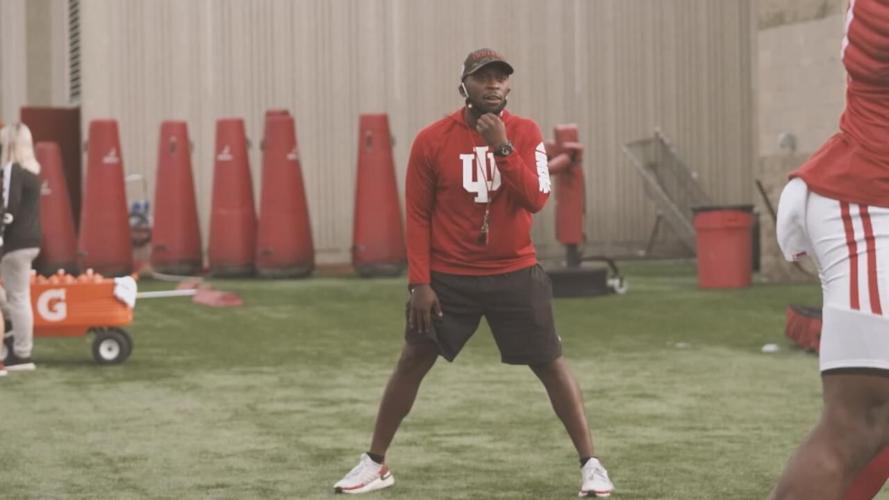 IU cornerbacks coach Brandon Shelby as players hit tackling sleds