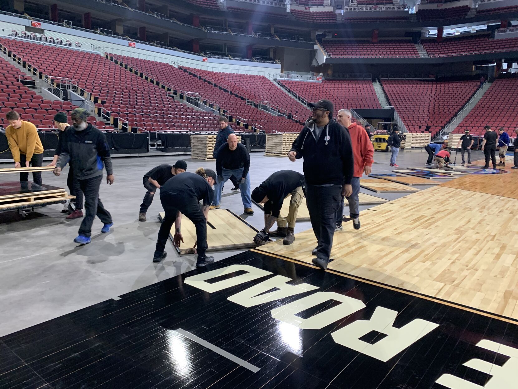 NCAA FLOOR  BEING INSTALLED AT YUM CENTER 3-21-2023 (1).JPG