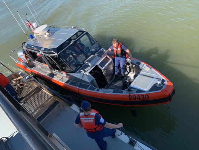 The U.S. Coast Guard vessel approaches a tow boat during training on the Ohio River