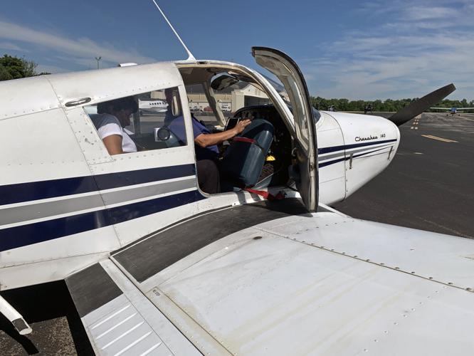 Students in the OBAP Shawnee ACE Academy taking a flight on a small plane at Louisville's Bowman Field