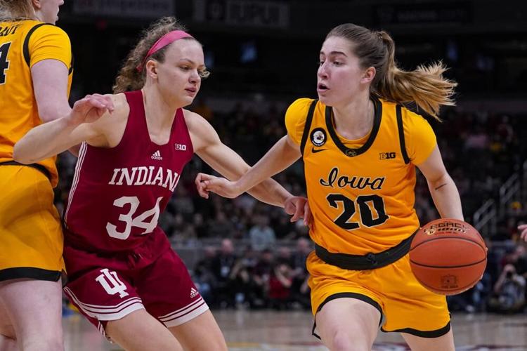 Iowa guard Kate Martin drives on Indiana guard Grace Berger in the first half.jpeg