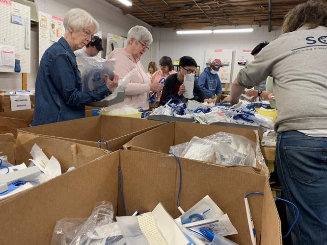 Volunteers at Louisville-based SOS assemble medical kits bound for Ukraine