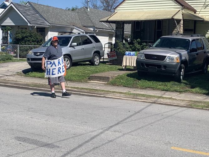 Neighbors park cars outside of Churchill Downs for Oaks